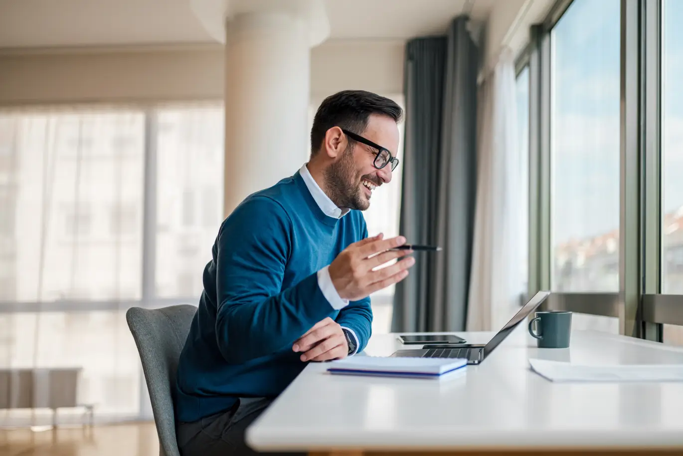 Man working at his desks on a sales call
